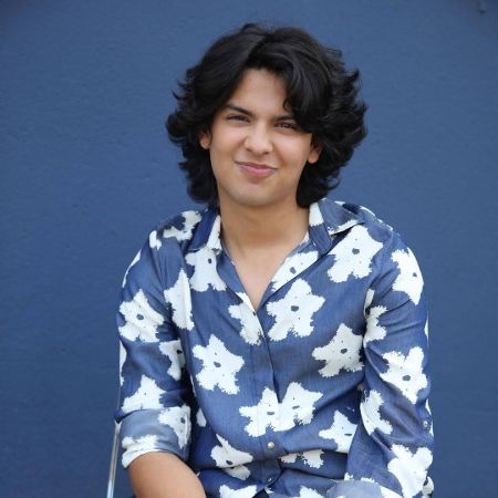 Xolo Maridueña poses a picture in a photoshoot.